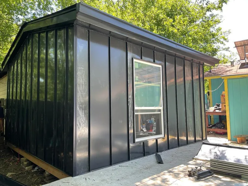 Black standing seam metal wall panels for Roof Inspection in Orono