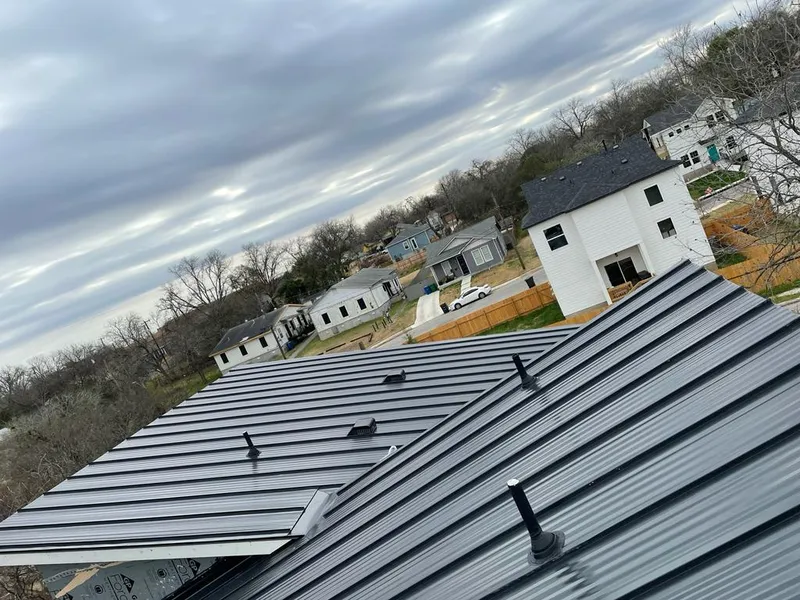 Standing seam metal roof panels with vents for Skylight Repair in Orono
